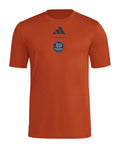 Houston Dynamo 2026 orange travel shirt front with dark crest