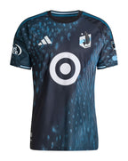 Minnesota United 2026 home shirt front, dark Decade kit with loon wing pattern