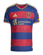 Real Salt Lake 2026 home shirt front, claret and cobalt Switchback hoops